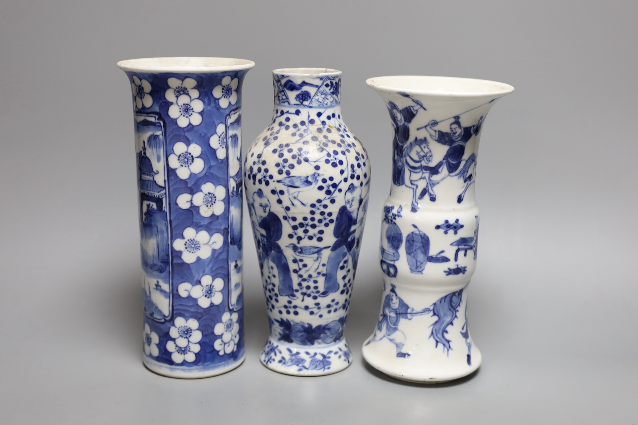 A Chinese blue and white sleeve vase and two other similar vases, late Qing dynasty, tallest 21 cms high